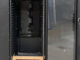 an image of a black cabinet with a door open