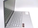 a silver laptop computer sitting on top of a white table