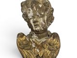 an old statue of an angel with wings on a white background