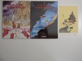 trois livres qui sont accrochés au mur les uns à côté des autres