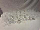 a lot of wine glasses sitting on a table