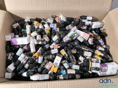 a cardboard box filled with bottles of alcohol