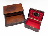 a small wooden box with a mirror inside of it