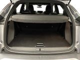 the back of a car with the trunk open and the seats folded down