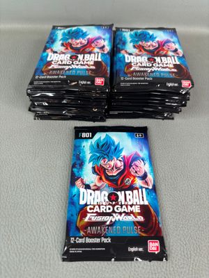 three packs of dragon ball trading cards sitting on top of a table