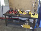 a workbench with many tools on it in a garage
