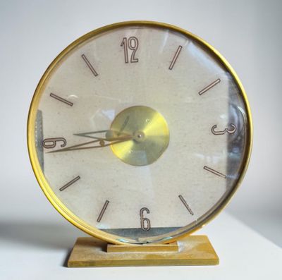 a clock that is sitting on top of a table