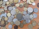a lot of coins that are on the table