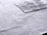 a white table cloth with a pattern on it