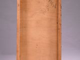 an old wooden box with a drawing of a tree on it