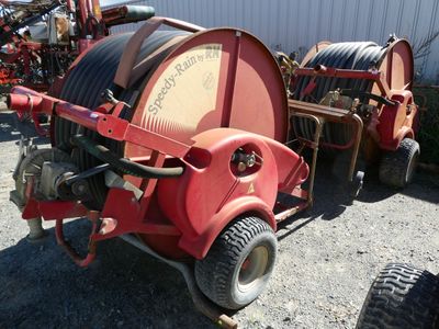 an image of a red fire hydrant with a hose attached to it