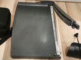 an image of a piece of paper being cut on a cutting board