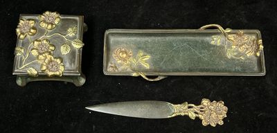 a knife and a box sitting next to each other on a black surface