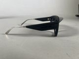 a pair of black sunglasses sitting on a table