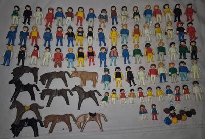 a lot of toy figurines that are on a table