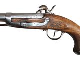 an old gun with a wooden handle on a white background