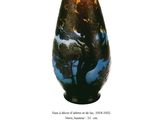 a picture of a vase with a picture of a tree on it