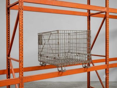 a close up of a shopping cart on a shelf in a room