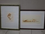 two framed pictures of a woman laying down on the floor