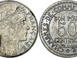 a silver coin with a woman ' s head on it