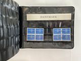 a picture of a wallet with four stamps in it