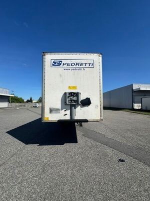 a white box truck that is parked in a parking lot