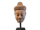 an image of a statue of a head with a hat on it
