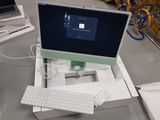 a computer sitting on top of a box on a table