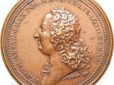 an image of a gold coin with a woman ' s head on it