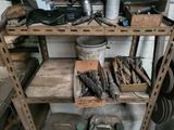 many tools on a shelf in a garage