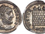 a silver coin with a bust of a man on it