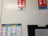 a fire extinguisor sign on the door of a building