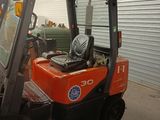 a forklift that is parked in a garage