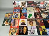 a lot of different album covers on the table
