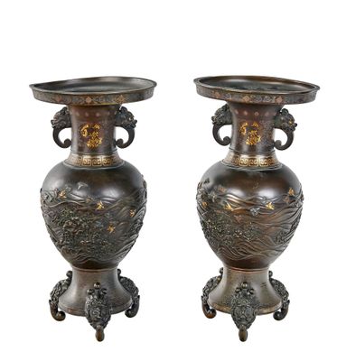 two vases that are sitting side by side on a white background