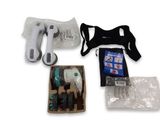 a package of items that include a hair dryer, scissors, and other items