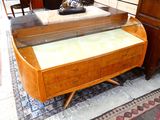 a glass display case on a wooden table in a living room