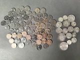 a bunch of coins sitting on top of a table next to each other