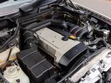a car engine with its hood open on the street