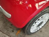 a red car that is parked in a garage
