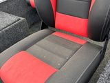 a red and black seat in the back of a boat