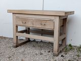 a wooden table with two drawers on top of it
