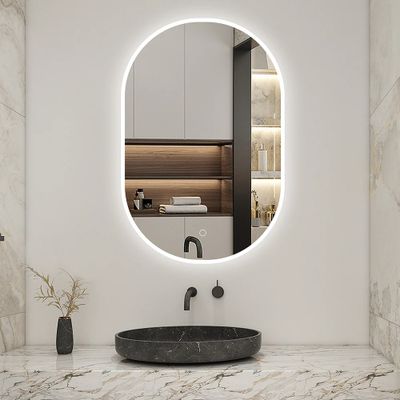 a bathroom with a sink and a mirror in it