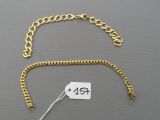a close up of a gold chain with a price tag on it