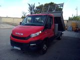 a red truck that is parked in a parking lot