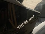 a close up of a motorcycle with a helmet on it