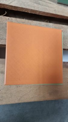 a brown book sitting on a wooden table