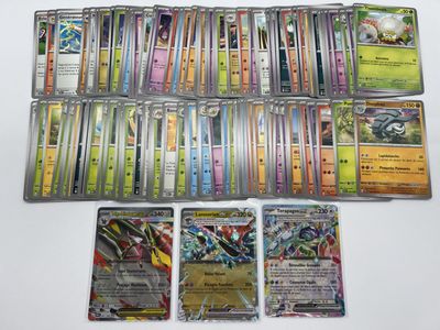 a lot of pokemon cards that are on the table