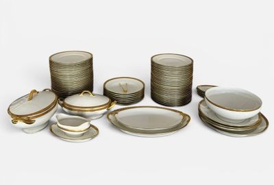 many different types of plates and bowls on the table