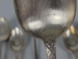 a lot of spoons that are sitting on a table